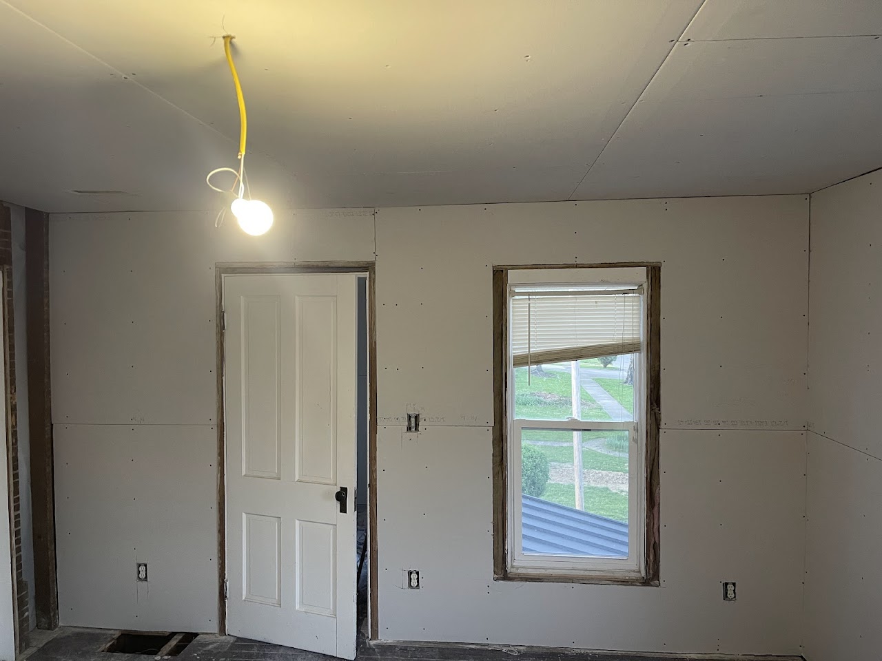 Fresh drywall in a renovated room
